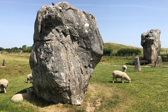 A large unshaped sarsen standing on the turf at Avebury