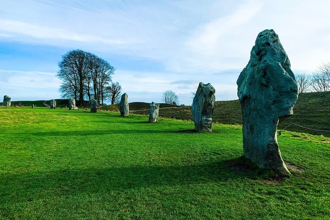 Avebury standing stones below the beech trees growing on the henge bank